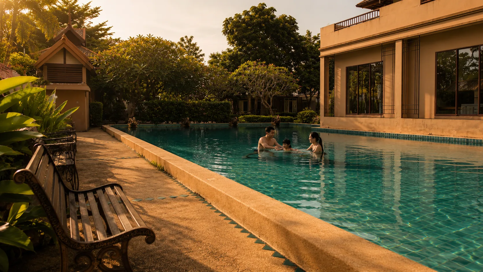 Family in the community pool at golden hour