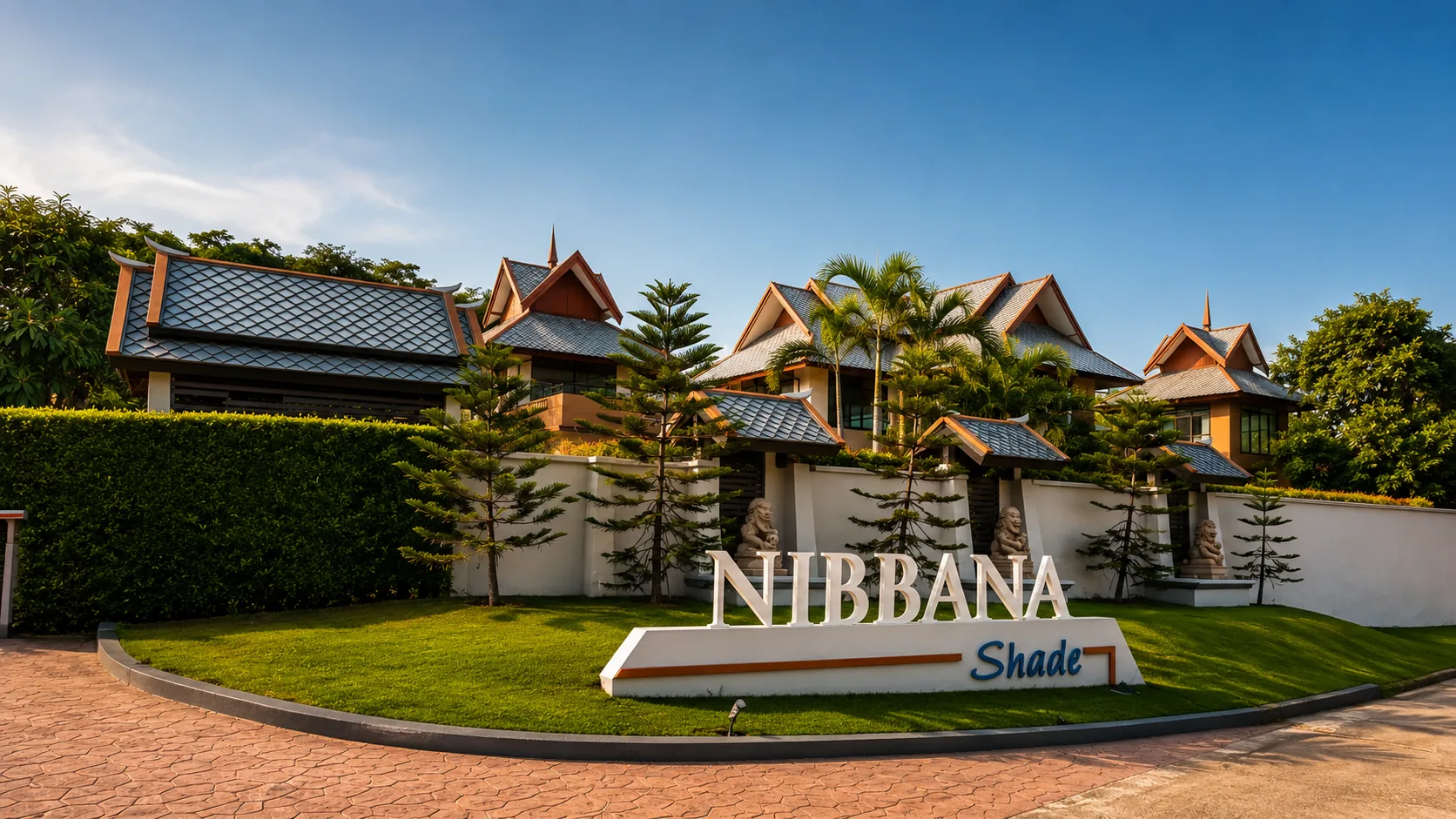 The tree-lined entrance to Nibbana Shade village