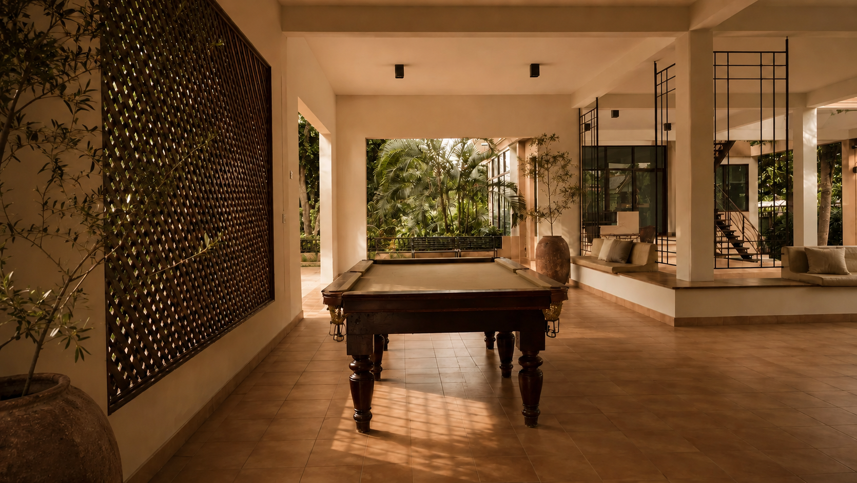 A Nibbana Shade villa beside the pool at golden hour